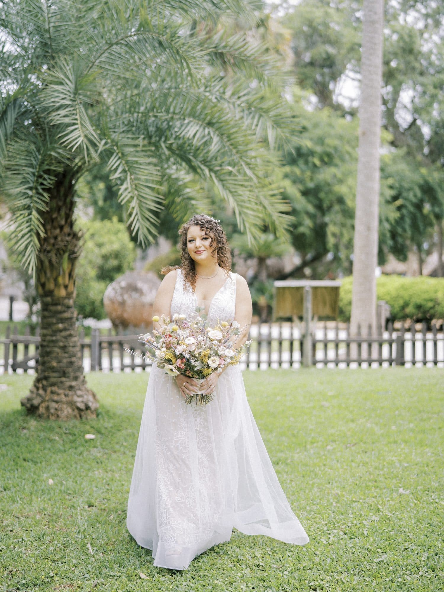 Bride with a natural curly bridal hairstyle