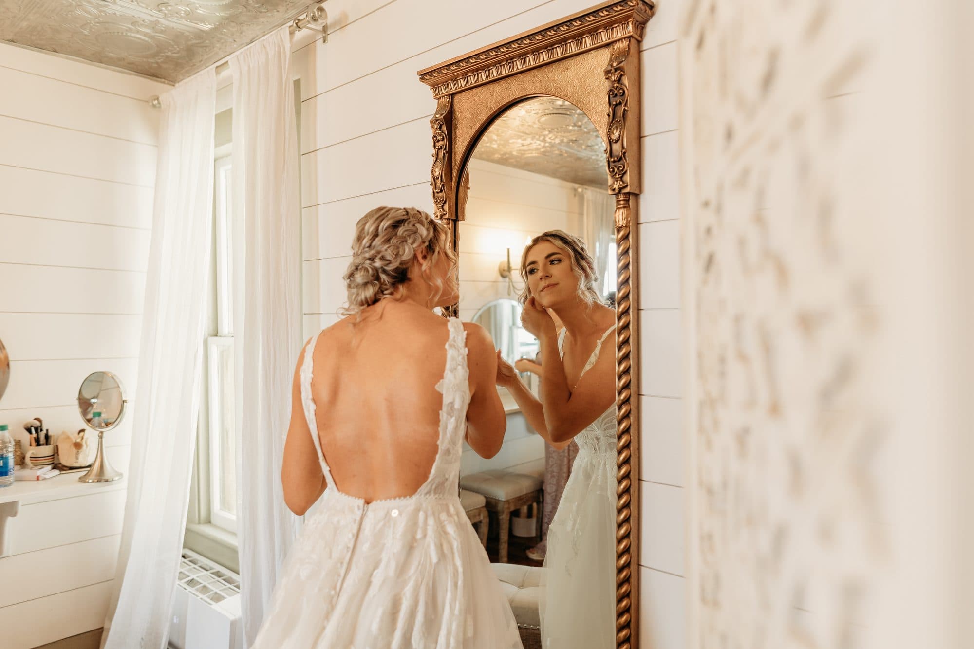 Bride with polished updo and glowing makeup