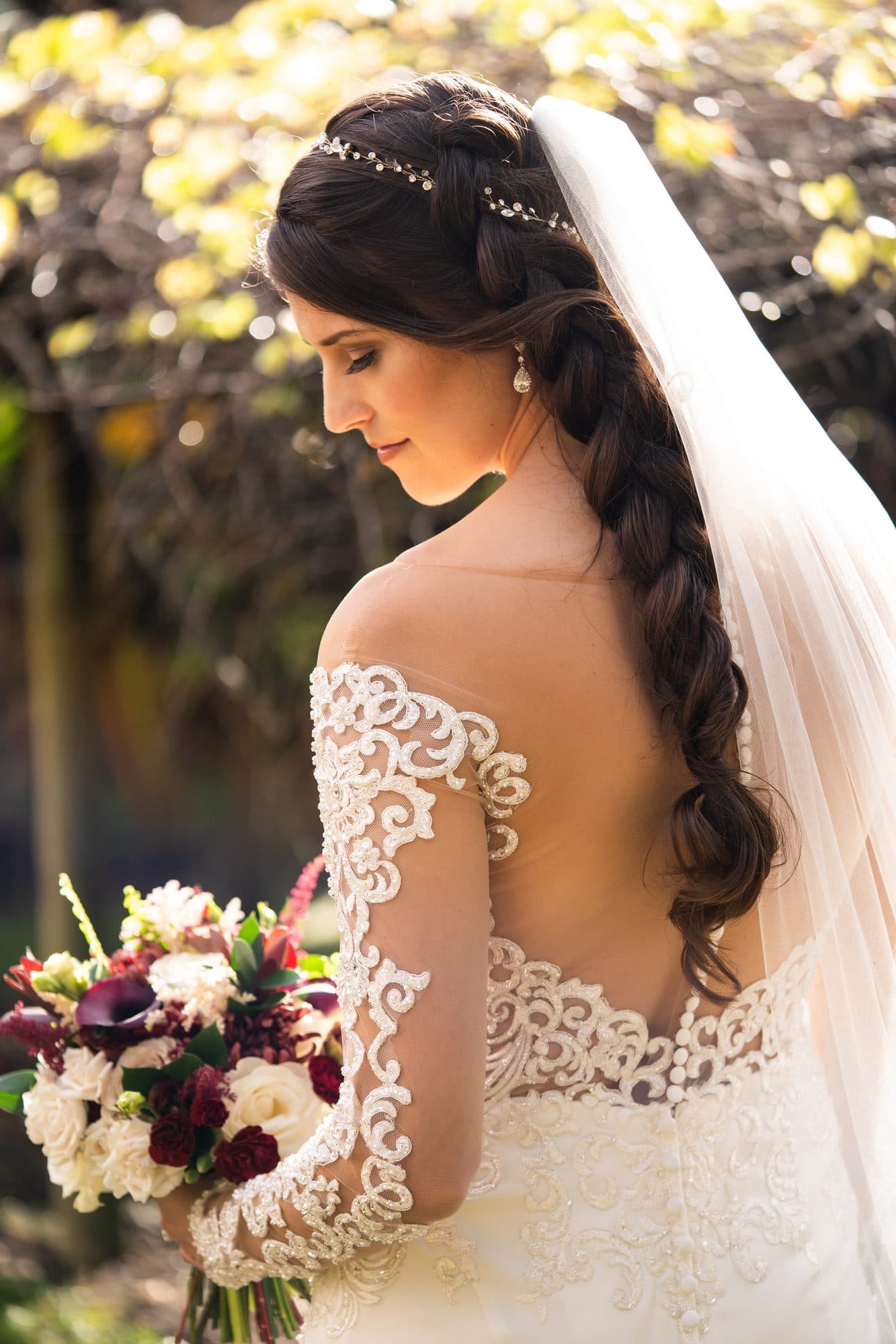 Bride with an elegant styled updo and radiant wedding makeup
