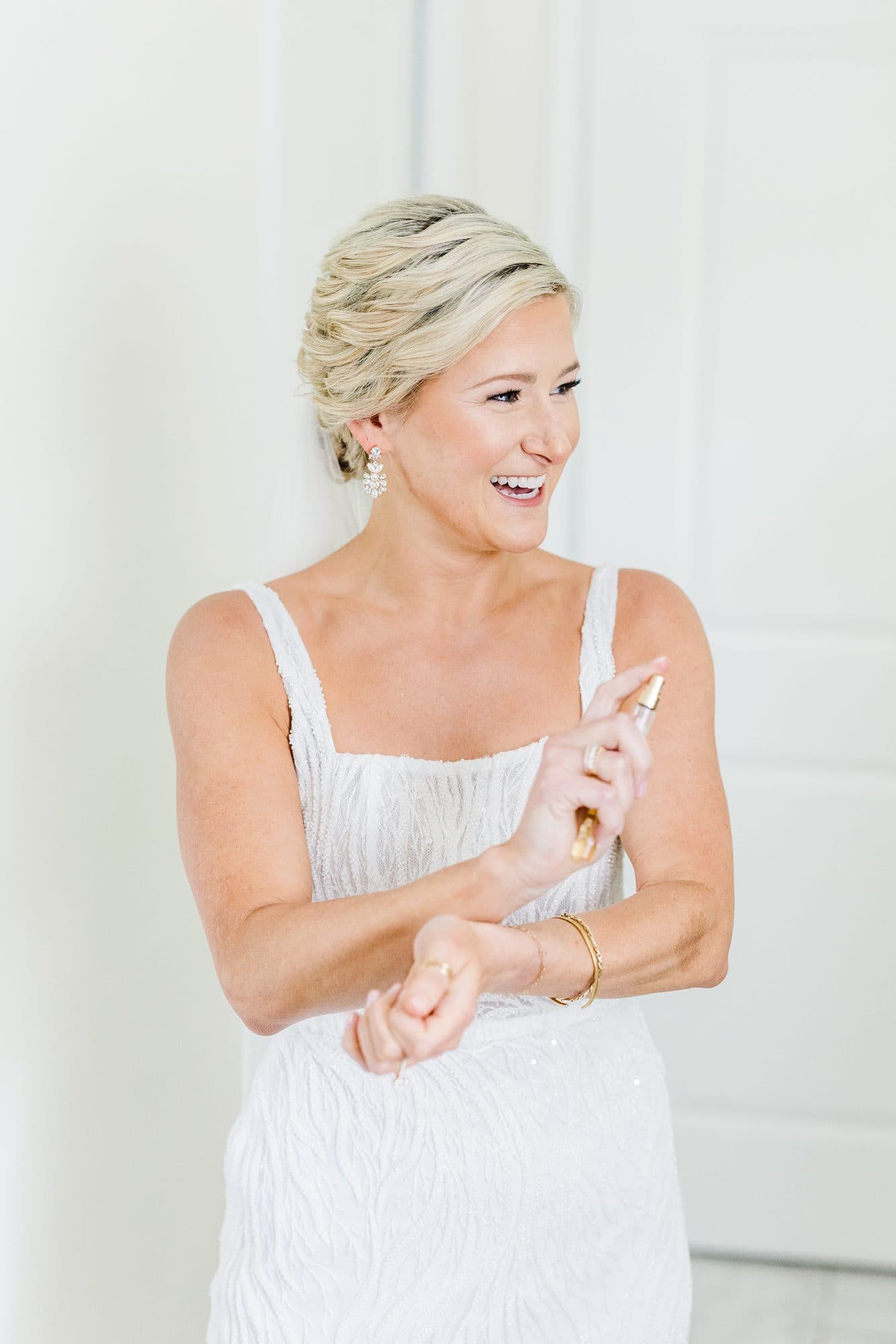 Bride Caleigh getting ready on her wedding morning