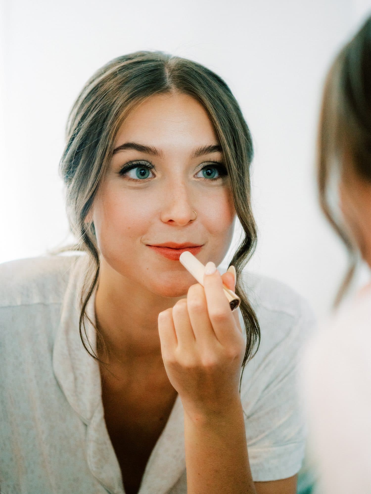Bride with soft, romantic bridal hair and glowing natural makeup