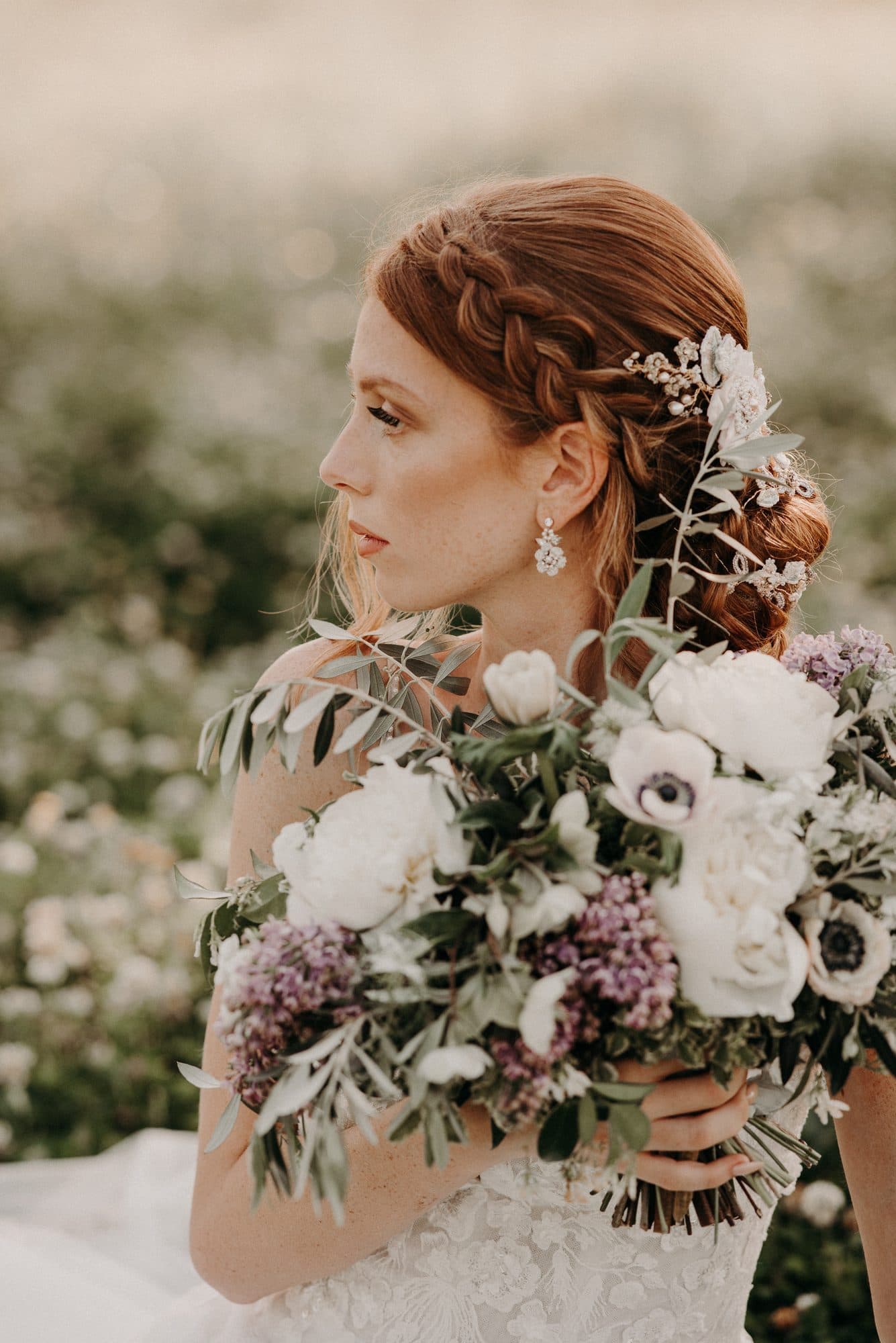 Bride with an elegant styled updo and radiant wedding makeup