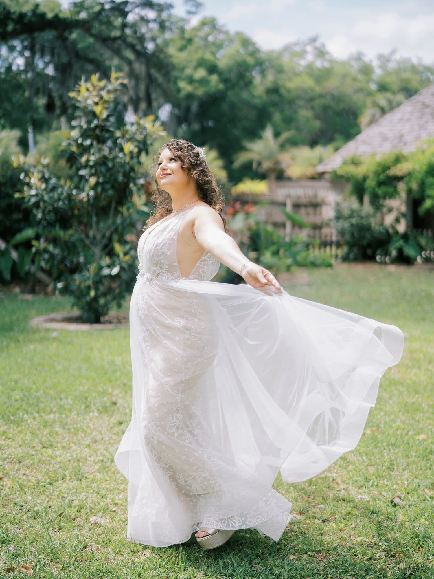 Detailed bridal hairstyling with a soft, luminous makeup look