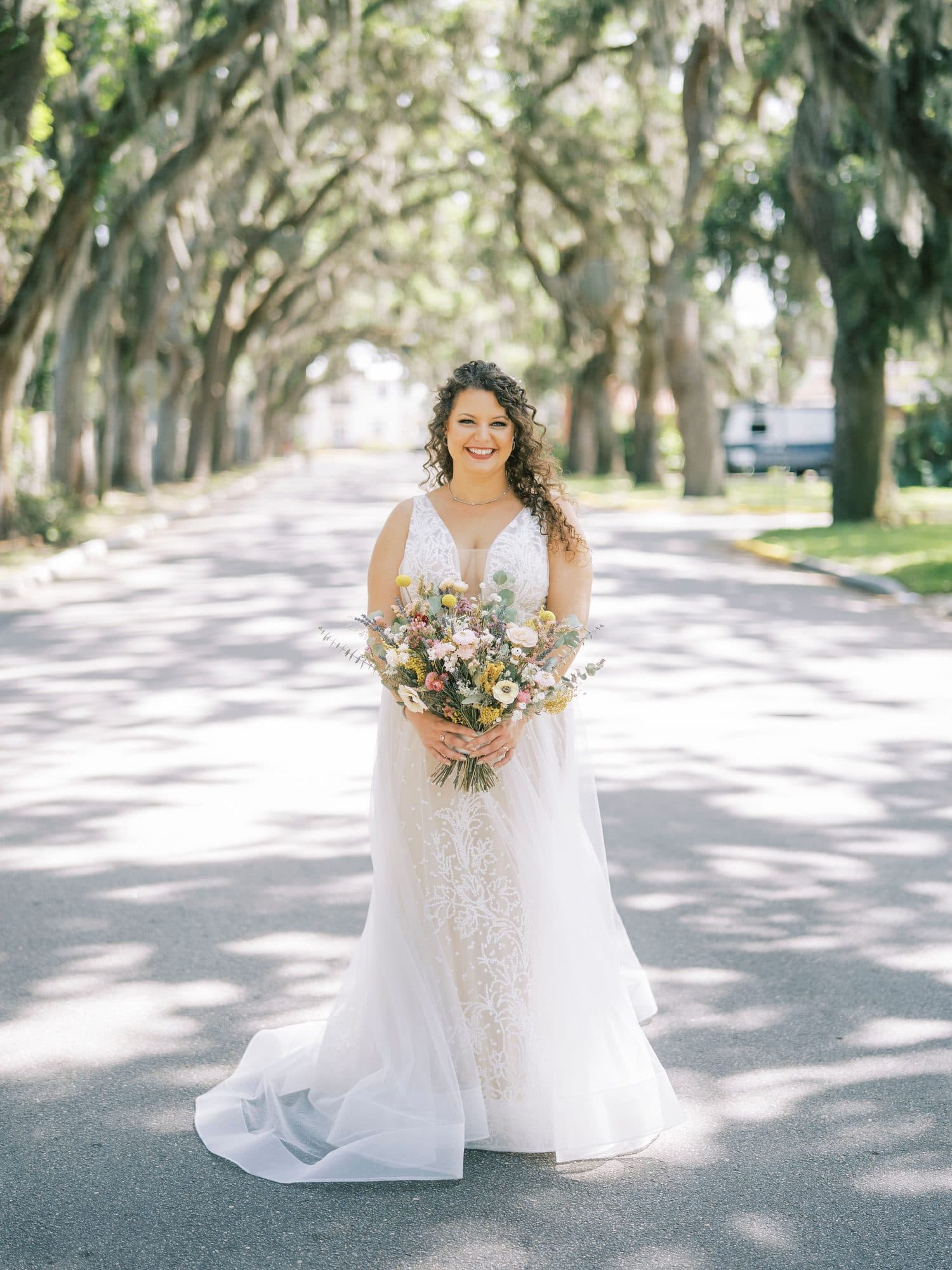 Bride photographed after hair and makeup on her wedding morning