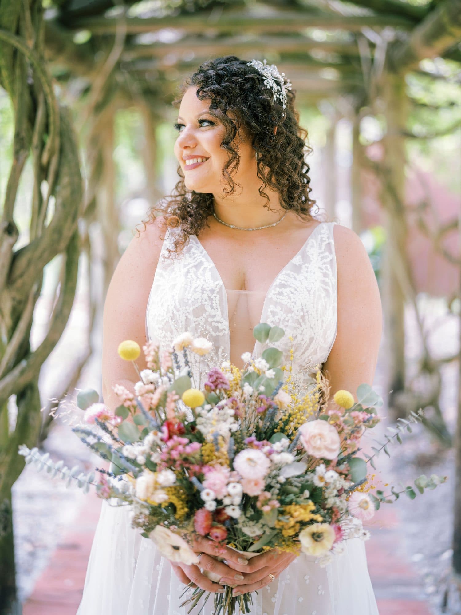 Bride with soft, romantic bridal hair and glowing natural makeup