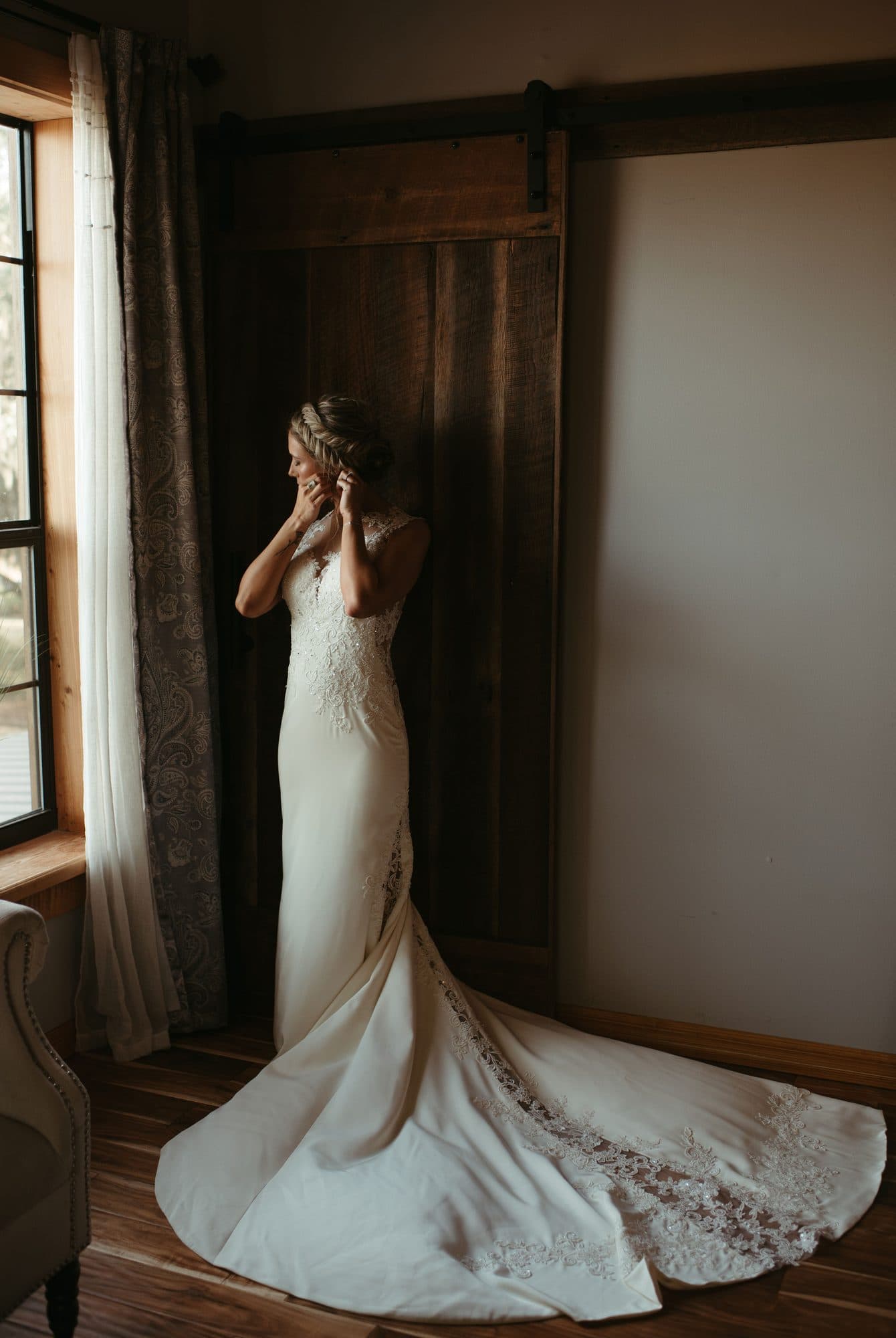Bride with an elegant styled updo and radiant wedding makeup