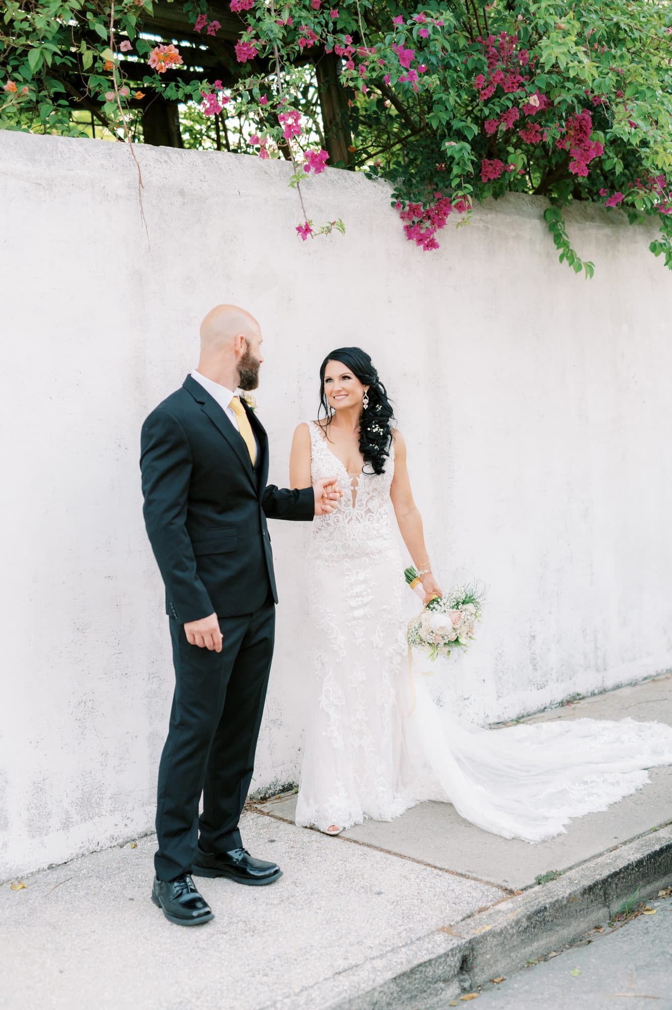 Detailed bridal hairstyling with a soft, luminous makeup look
