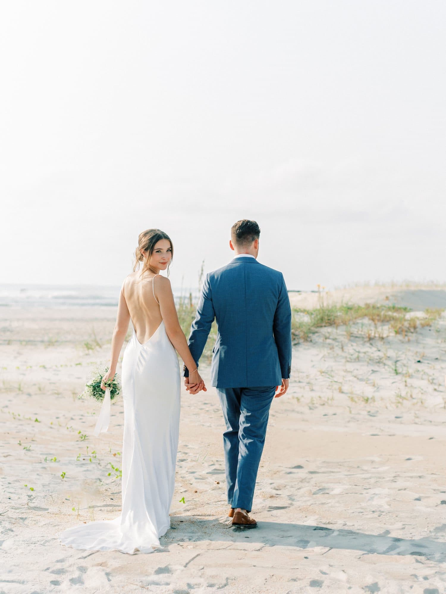 Beach bride with wind-ready hair and long-wear bridal makeup