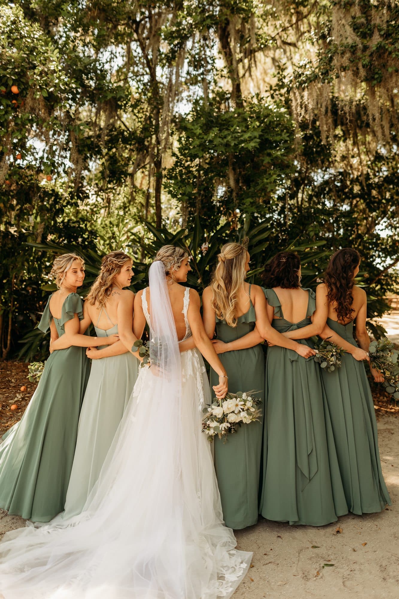 Bride and bridesmaids ready with finished hair and makeup