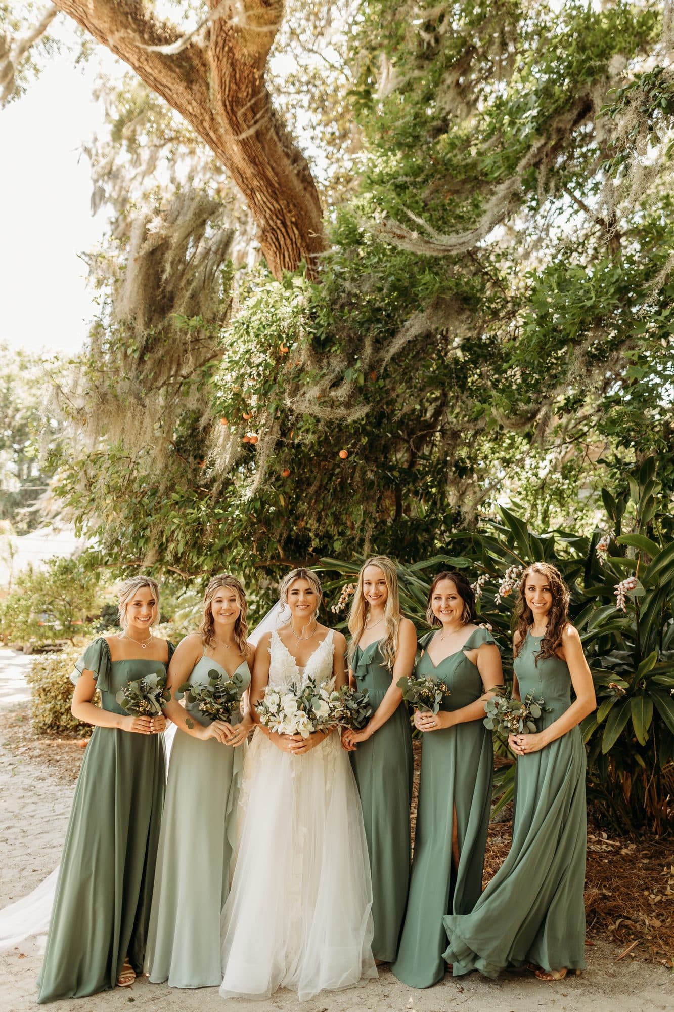 Bridesmaids with coordinated wedding-day hair and makeup