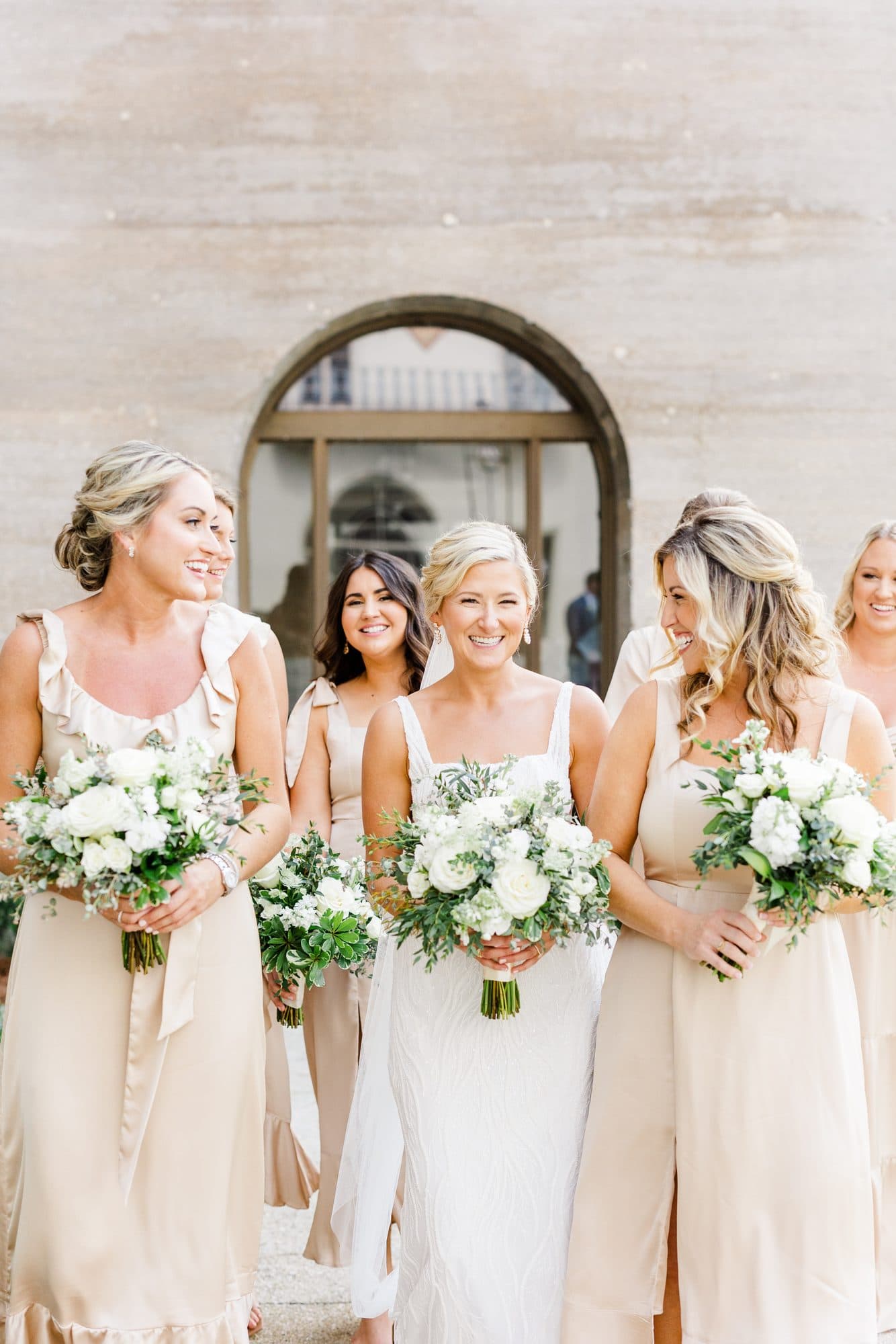 Caleigh and her wedding party with finished hair and makeup