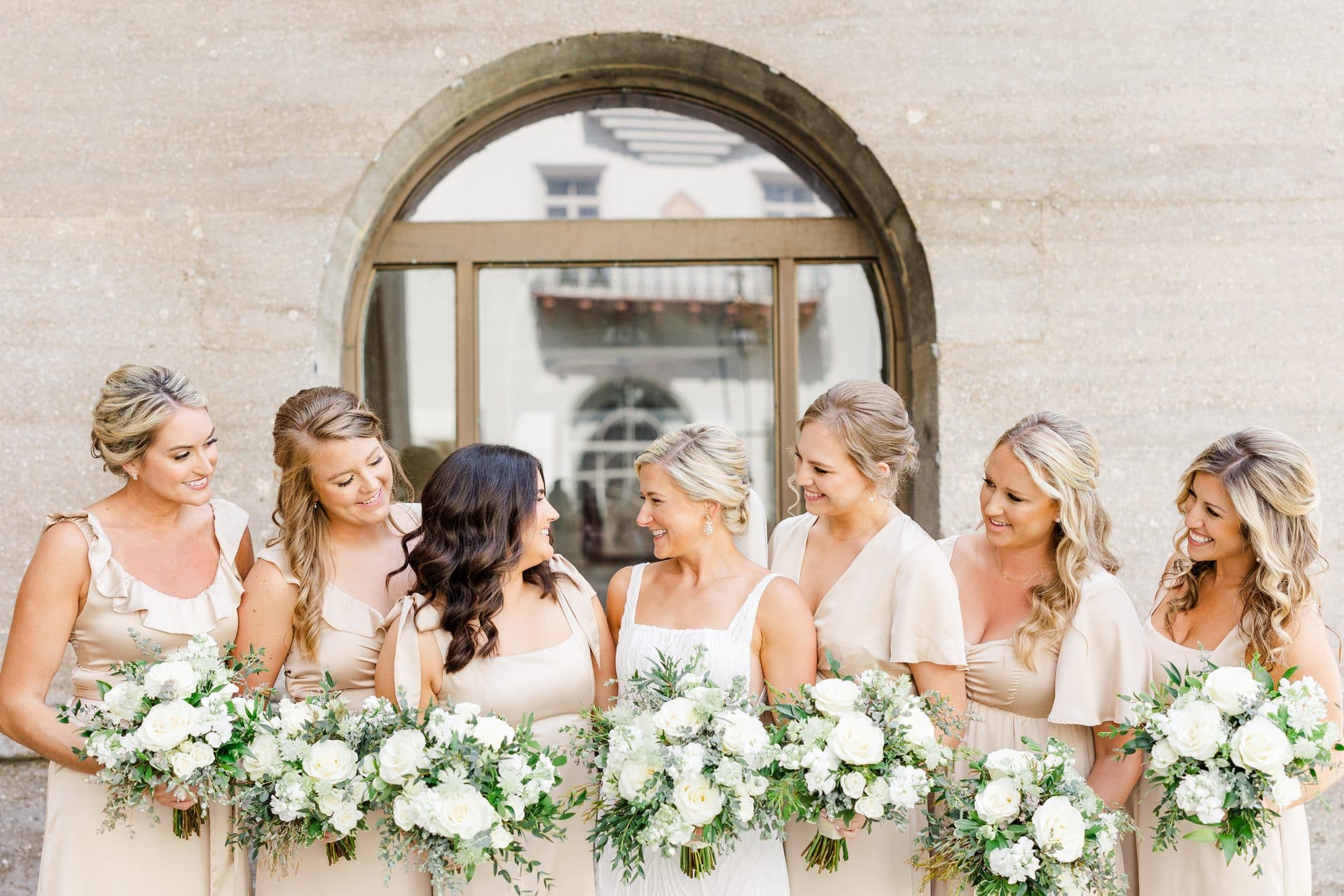 Caleigh and her wedding party with finished hair and makeup
