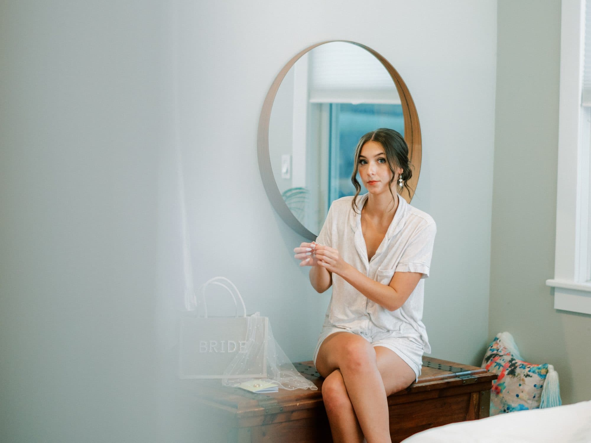 Finishing touches during a bride's wedding-morning beauty session