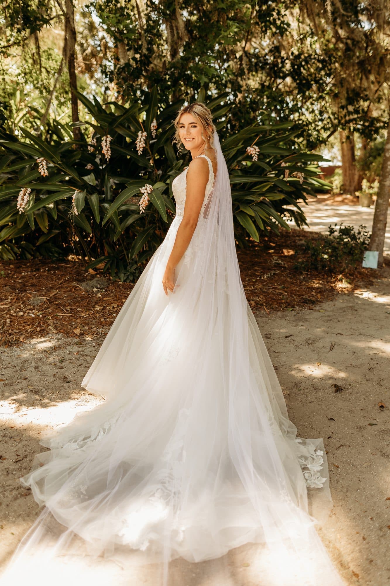 Bride Hailey with romantic styled hair and natural glam makeup